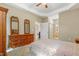 Bedroom featuring a cozy bed, carpet, and a sizable dresser with decorative mirrors at 127 Bobwhite Way, Mebane, NC 27302