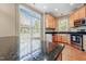 This bright kitchen features modern stainless appliances and granite countertops; the perfect space for cooking and entertaining at 127 Bobwhite Way, Mebane, NC 27302