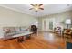 Cozy living room with hardwood floors, comfortable seating, and patio access, perfect for relaxing and entertaining at 127 Bobwhite Way, Mebane, NC 27302