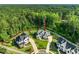 Expansive aerial view of a luxury home and surrounding wooded area, showcasing its prime location and neighborhood layout at 1409 Montvale Ridge Dr, Cary, NC 27519
