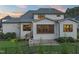 Beautiful backyard featuring a screened porch, and outdoor kitchen with built in grill and a black fence at 1409 Montvale Ridge Dr, Cary, NC 27519