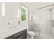 Modern bathroom featuring glass shower, white countertops and gold hardware at 1409 Montvale Ridge Dr, Cary, NC 27519