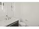 Modern powder room with sleek vanity, stylish mirror, and contemporary lighting fixtures at 1409 Montvale Ridge Dr, Cary, NC 27519