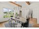 Spacious dining room with hardwood floors, large windows, modern decor and an open staircase view at 1409 Montvale Ridge Dr, Cary, NC 27519
