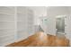 Upstairs hallway with built-in bookshelves with access to bathroom at 1409 Montvale Ridge Dr, Cary, NC 27519