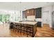 Bright kitchen with large island, modern lighting, and stainless steel appliances at 1409 Montvale Ridge Dr, Cary, NC 27519