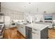 Bright kitchen with sleek cabinetry, stainless steel appliances, and a large center island at 1409 Montvale Ridge Dr, Cary, NC 27519