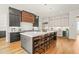 Modern kitchen featuring large island, sleek countertops and stainless steel appliances at 1409 Montvale Ridge Dr, Cary, NC 27519