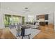 Open-concept living space with hardwood floors, neutral decor and access to the patio at 1409 Montvale Ridge Dr, Cary, NC 27519