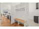 Inviting mudroom features a built-in bench with storage and hooks for organizing coats and bags at 1409 Montvale Ridge Dr, Cary, NC 27519