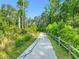 The community walking path is surrounded by mature trees and lush greenery, offering a serene experience at 1409 Montvale Ridge Dr, Cary, NC 27519