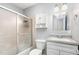 Bathroom with white vanity and a shower with a sliding glass door at 141 Weston Rd, Garner, NC 27529