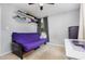 Spare bedroom featuring a futon sofa, shelving and a work desk at 141 Weston Rd, Garner, NC 27529