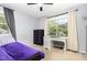Bedroom with a large window, desk and dresser with purple accents at 141 Weston Rd, Garner, NC 27529
