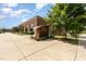Well-maintained brick building with a modern sign, set against a clear blue sky at 141 Weston Rd, Garner, NC 27529