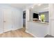 Hallway showing nice floors and a large opening into another room at 141 Weston Rd, Garner, NC 27529