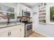 Modern kitchen with stainless steel appliances, granite countertops, and stylish backsplash at 141 Weston Rd, Garner, NC 27529