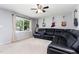 Comfortable living room with a large window, a ceiling fan, and distinctive guitar display at 141 Weston Rd, Garner, NC 27529