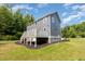 Exterior view of the house, backyard and wooded area that surrounds the property at 1605 Bobwhite Ln, Rocky Mount, NC 27804