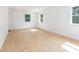 Bright and airy bedroom with hardwood floors and natural light from multiple windows at 1605 Bobwhite Ln, Rocky Mount, NC 27804