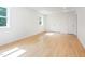 Bright bedroom with wood floor, closet, and natural light from the two windows at 1605 Bobwhite Ln, Rocky Mount, NC 27804