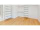 Bright walk-in closet with custom shelving and closet rods for optimal storage and organization at 1605 Bobwhite Ln, Rocky Mount, NC 27804
