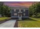 Charming exterior view of home with well-manicured yard, and a new driveway at 1605 Bobwhite Ln, Rocky Mount, NC 27804