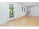 Bright and airy living room featuring light wood floors, white walls, and natural light at 1605 Bobwhite Ln, Rocky Mount, NC 27804