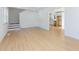 Open living space with light wood floors, connecting to the kitchen and stairs at 1605 Bobwhite Ln, Rocky Mount, NC 27804