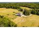 Picturesque property featuring a main house, pond, manicured lawns, and extensive pasture land at 1625 Haystack Ln, Burlington, NC 27217