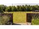 Picturesque backyard with a lush green lawn, string lights, and wooden privacy fencing at 1625 Haystack Ln, Burlington, NC 27217