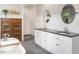 Bright bathroom featuring double vanity, soaking tub, and tiled shower at 1625 Haystack Ln, Burlington, NC 27217