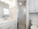 Well-lit bathroom features white vanity, shower, and neutral finishes at 1625 Haystack Ln, Burlington, NC 27217