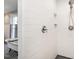 Modern bathroom featuring tiled shower with built-in niches and separate soaking tub at 1625 Haystack Ln, Burlington, NC 27217