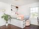 Bright bedroom with custom built-in bed and shelving with lots of natural light at 1625 Haystack Ln, Burlington, NC 27217