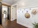Welcoming entryway with modern wainscoting and hat rack, offers a glimpse into living spaces at 1625 Haystack Ln, Burlington, NC 27217