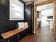 Entryway featuring storage, built-in bench, and direct access to the kitchen at 1625 Haystack Ln, Burlington, NC 27217
