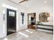 Bright entryway with decorative basket and table, offering a peek into the open-concept living area at 1625 Haystack Ln, Burlington, NC 27217