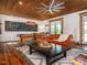 Spacious game room with a pool table, rustic wood ceiling, and leather furniture at 1625 Haystack Ln, Burlington, NC 27217