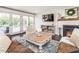Bright living room with fireplace, French doors, and comfortable seating; ideal for entertaining at 1625 Haystack Ln, Burlington, NC 27217