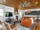 Charming living room featuring wood ceiling, hardwood floors, fireplace and pool table at 1625 Haystack Ln, Burlington, NC 27217