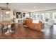 Open-concept living room featuring hardwood floors, modern furnishings, and a seamless flow to the kitchen at 1625 Haystack Ln, Burlington, NC 27217