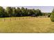 Spacious pasture featuring a charming stable, offering ample space for livestock and rural enjoyment at 1625 Haystack Ln, Burlington, NC 27217