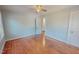 Bedroom featuring hardwood floors and light blue walls with natural light coming in from a window at 171 Magnolia Dr, Roxboro, NC 27573