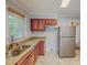 Updated kitchen with stainless steel appliances, granite countertops, and wood cabinets offers modern functionality at 171 Magnolia Dr, Roxboro, NC 27573