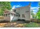 Back exterior view of the home with a screened-in porch, and a partially fenced-in backyard at 1905 Indianwood Ct, Raleigh, NC 27604