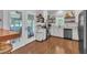 Updated kitchen features stainless steel appliances, granite countertops, and access to sunroom at 1905 Indianwood Ct, Raleigh, NC 27604