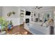 Cozy living room with a fireplace, built-in shelving, hardwood floors, and ample natural light, perfect for relaxation at 1905 Indianwood Ct, Raleigh, NC 27604