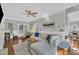 Open-concept living room with hardwood floors, a comfortable sofa, and a cozy seating area, creating a welcoming atmosphere at 1905 Indianwood Ct, Raleigh, NC 27604