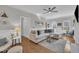 Spacious living room with hardwood floors, a comfortable sectional sofa, and a cozy seating area, perfect for entertaining at 1905 Indianwood Ct, Raleigh, NC 27604